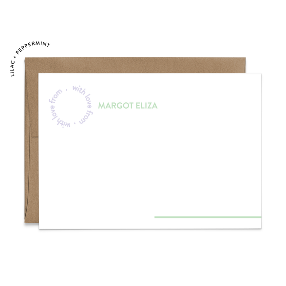 Image of a white flat note card and a kraft brown envelope. The card has the words “with love from” repeating in a circle shape in the top left corner and an example of a name next to it. There is a line in the bottom right corner that extends off of the card.