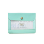 An image of a small mint general purpose case with a gold clasp and clear window on the front