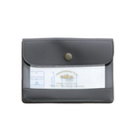 An image of a small charcoal grey general purpose case with a gold clasp and clear window on the front