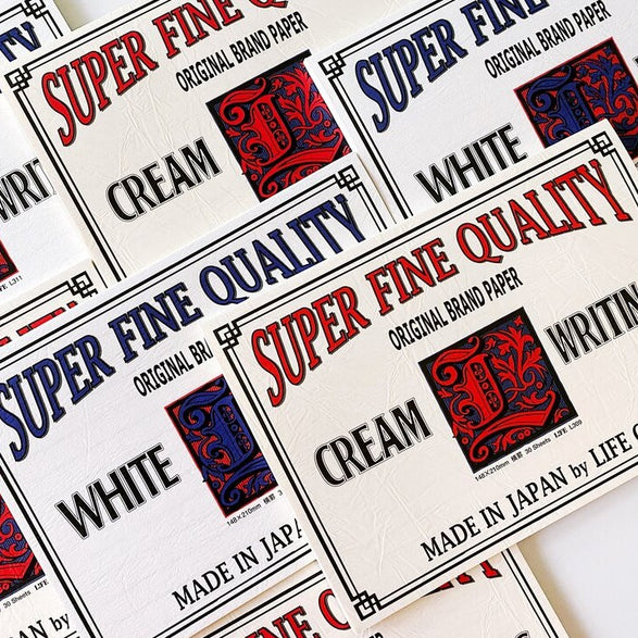 Image of a pile of white and cream letter paper pads with text "Super fine quality original brand paper made in Japan by Life Co."